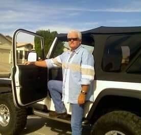 Michael DOC Dwyer standing by his Jeep